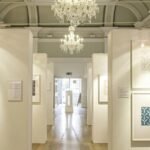 a hallway with a chandelier
