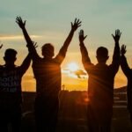 people silhouette during sunset