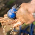 close up shot of a person washing dirty hand